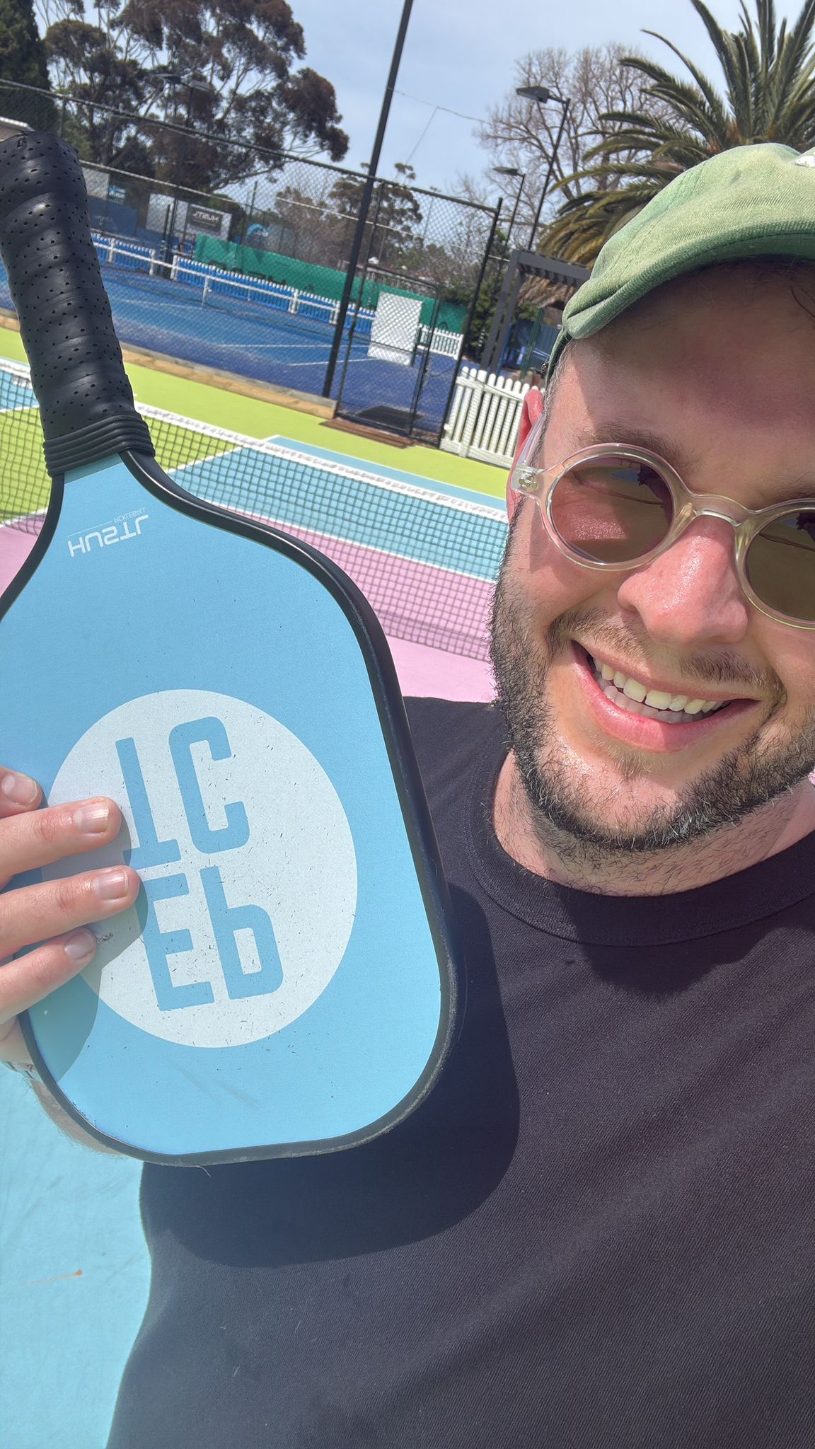 Josh with paddle at outdoor courts